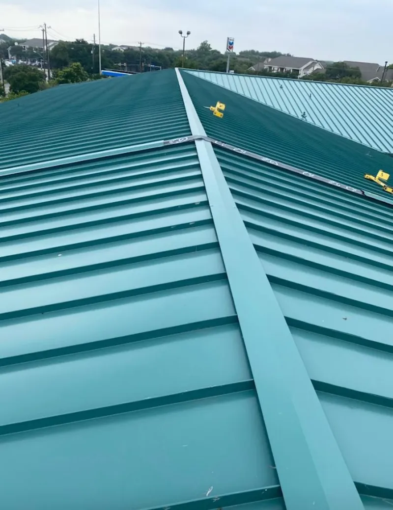 Green commercial metal roof ridge and valley for Metal Roof Repair in Ferguson