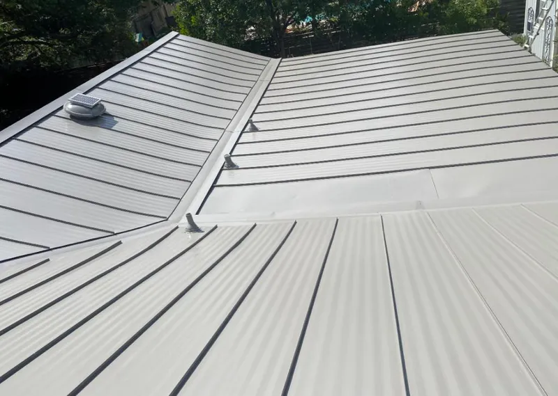 Solar attic fan installed on a metal roof for Roof Ventilation in Ferguson